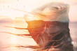© alphaspirit - Woman with hair blowing in the wind during sunset