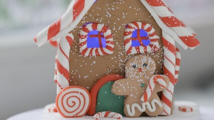 Wall Mural - Christmas house with a gingerbread man