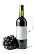 Red wine and blue grapes are isolated on white.