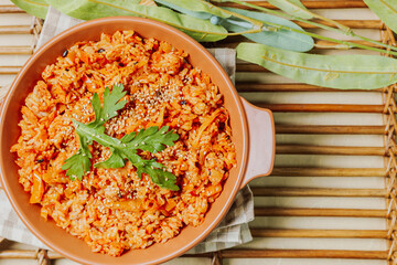 Wall Mural - Kimchibokkeumbap, Korean Kimchi Fried Rice : Rice fried with finely chopped kimchi. Beef, pork, onions, green onions, and other vegetables may be added according to taste.