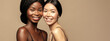 Beauty. Multi Ethnic Group of Womans with diffrent types of skin  together and looking on camera. Diverse ethnicity women -  African and Asian posing and smiling against beige background.
