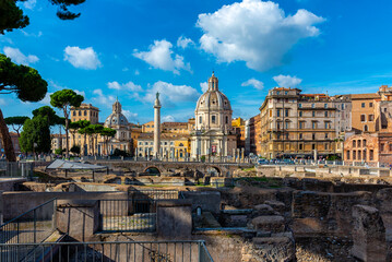 Wall Mural - Colonna di Traiano, churches of Santa Maria di Loreto, Santissima Nome di Maria (Most Holy Name of Mary) and ruins of Foro di Traiano in the foreground, Rome, Italy. Architecture and landmark of Rome.