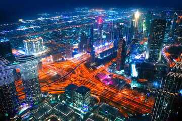 Canvas Print - Dubai city at night, view with lit up skyscrapers and roads.  