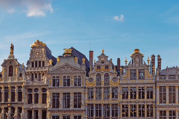 Abstract urban or vintage background featuring details of architecture and roofs of medieval buildings at sunset at Grand Place in Brussels Belgium. 