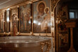 baptism font with water with burning candles in an Orthodox church