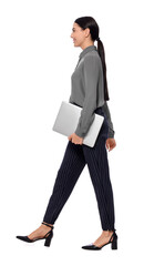 Wall Mural - Young businesswoman with laptop walking on white background