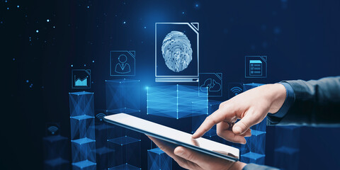 Poster - Close up of businessman hand pointing at tablet with abstract glowing fingerprint hologram on blurry blue background. Personal security concept.