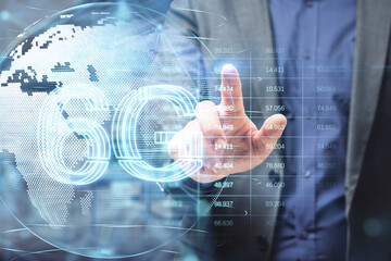 Poster - Close up of man hands pointing at glowing planet earth globe hologram with 6G and index graph on blurry office background. Mobile internet network, speed and signal. Double exposure.