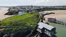 Old And New Lifeboat Stations Tenby North Wales UK Beach Harbour Drone Aerial View .