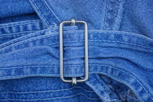 One Gray Metal Fastener On A Blue Tulle Fabric Harness On Clothes
