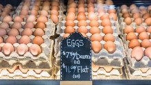Eggs For Sale On Display For Local Business Stall At Farmer's Market. Fresh Brown Chicken Eggs Organic Produce Background
