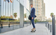 © Cavan Images - young businessman goes to work on a skateboard