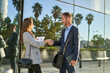 © Cavan Images - Business people dressed in formal wear shaking hands