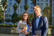 © Cavan Images - Business people dressed in formal wear looking at camera