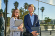 © Cavan Images - Business people dressed in formal wear looking at camera