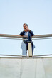 © Cavan Images - caucasian businessman standing in a modern open space