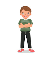 Wall Mural - cute little boy standing with arms crossed pose