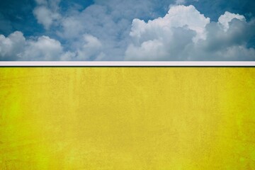 Wall Mural - fortuna gold grunge wall with dark blue sky background.