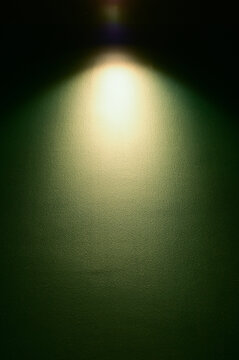dark green wall and warm electric light, interior design