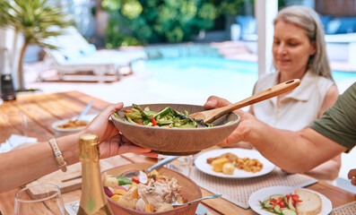 Hands, food and family relax on a patio, eating, bond and sharing a meal at a table together. Friends, salad and senior woman calm, content and enjoy healthy lunch with hungry group on a terrace