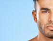 © Wesley J/peopleimages.com - Health, skincare and portrait of man blue background with mockup, advertising space or product placement. Luxury male body care, clean face closeup and healthy lifestyle mindset in studio background.