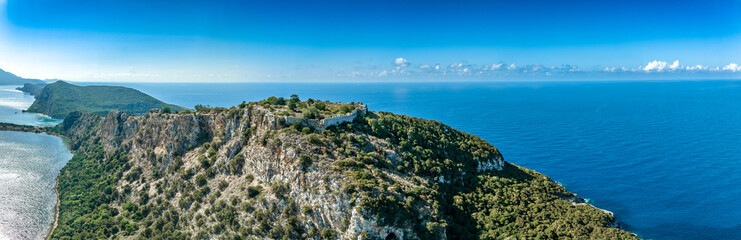 Ruins of the old Venetian fortress above the blue waters of Navarino beach in Greece