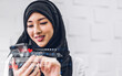 © Art_Photo - Portrait of muslim woman use digital smartphone with business future Ai technology link internet connection network bigdata wireless Artificial Intelligence internet.Ai and technology