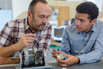 young man working in the robotics classroom