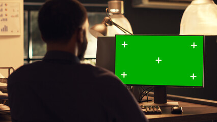 Poster - Successful office worker analyzing computer with greenscreen, looking at chroma key display at job. Working with isolated mockup template and blank copyspace background, pc desktop.