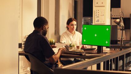 Poster - African american man working with greenscreen on computer, analyzing isolated mockup template at sunset hour. Using blank chroma key copyspace background, looking at pc screen.