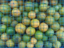 Sweet Limes Kept In A Basket In Market For Sale.