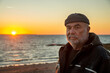 © Westend61 - Retired senior man enjoying sunset at beach