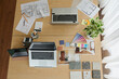 © DragonImages - Documents with House Plan on Desk of Interior Designer