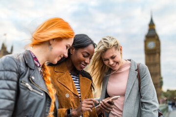 Wall Mural - Multiracial group of girls in London next to Big Ben