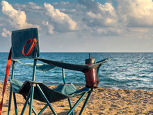 Folding Camping Chair Facing The Sea On The Beach In The Evening In Autumn