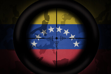 Wall Mural - sniper scope aimed at flag of venezuela on the khaki texture background. military concept. 3d illustration