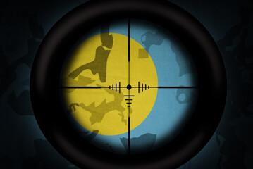 Wall Mural - sniper scope aimed at flag of Palau on the khaki texture background. military concept. 3d illustration