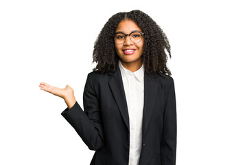 Wall Mural - Young african american business woman isolated showing a copy space on a palm and holding another hand on waist.