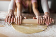 © Prostock-studio - Caucasian little granddaughter and elderly grandmother smeared with flour tell dough with rolling pin for baking