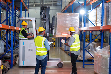 Wall Mural - African american working in warehouse hold red light give signal to truck loading carton box