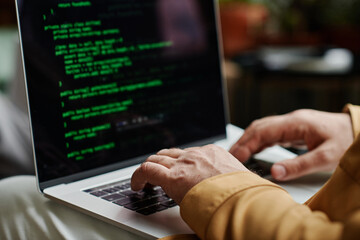 Fototapete - Hands of modern programmer or software developer typing on laptop keyboard while decoding data or working over new IT project