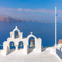 Santorini, Greece. White Bell Arch And Blue Sea View With Boats. Conceptual Composition Of The Famous Architecture Of Santorini Island.   Santorini Minimalist Photo Collection.