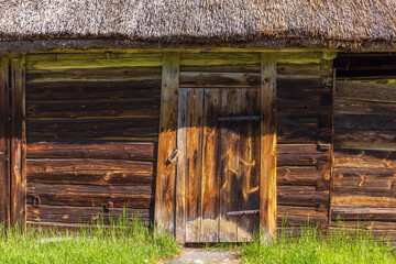 Canvas Print - Old wooden barn with thatched roof