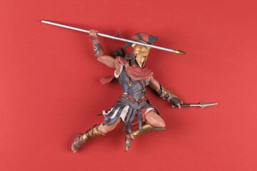 Canvas Print - spartan with spear isolated on red background