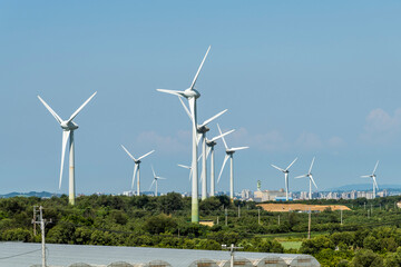 Canvas Print - Close-up of wind power systems with blue sky background on the west coast of Taiwan.