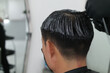 Back view of a man applying perm
