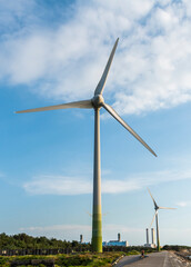 Wall Mural - Close-up of wind power systems with the blue sky background.