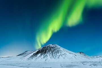 Wall Mural - aurora borealis. northern lights over the mountains. a winter night landscape with bright lights in 