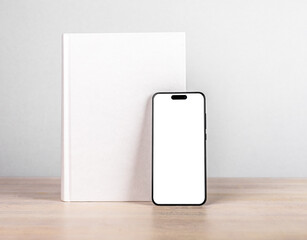 Poster - Book cover mock up and iphone 14, smart phone mockup on wood table