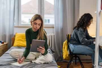 Wall Mural - college female students studying in room